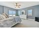 Beachfront bedroom with ocean views, a ceiling fan, and white dresser at 4950 Gulf Blvd # 206, St Pete Beach, FL 33706