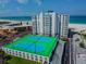 Aerial view of tennis courts adjacent to beachfront building at 4950 Gulf Blvd # 206, St Pete Beach, FL 33706