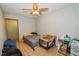 Simple bedroom with tiled floors and ceiling fan at 519 Greenway Dr, Plant City, FL 33566