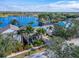 Aerial view of waterfront home with lush landscaping at 5205 Covesound Way, Apollo Beach, FL 33572