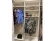 Bright walk-in closet with shelves and hanging rods at 5205 Covesound Way, Apollo Beach, FL 33572