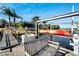 Wooden dock with kayak lift and bench overlooking water at 5205 Covesound Way, Apollo Beach, FL 33572