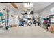 Garage with overhead storage and ample space for vehicles and equipment at 5205 Covesound Way, Apollo Beach, FL 33572