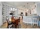 Modern kitchen with white cabinets, granite countertops, and a breakfast bar at 5205 Covesound Way, Apollo Beach, FL 33572