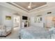 Main bedroom with king bed, fireplace, and ensuite bathroom at 5205 Covesound Way, Apollo Beach, FL 33572