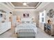 Main bedroom with king bed, decorative accents, and water view at 5205 Covesound Way, Apollo Beach, FL 33572