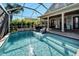 Relaxing pool with a spacious patio and covered area at 5205 Covesound Way, Apollo Beach, FL 33572