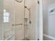 Modern shower with glass enclosure and built-in seat at 5205 Covesound Way, Apollo Beach, FL 33572