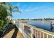 Scenic waterfront view with private dock and lush landscape at 5205 Covesound Way, Apollo Beach, FL 33572