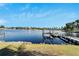 Serene waterfront view with dock and lush greenery at 5205 Covesound Way, Apollo Beach, FL 33572