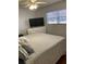 Relaxing bedroom with a king-size bed and plenty of storage at 5603 80Th N St # 107, St Petersburg, FL 33709