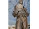 Bronze statue of a diver holding a helmet at 1408 Riverside Dr, Tarpon Springs, FL 34689