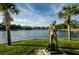 Scenic waterfront park with a statue and palm trees at 1408 Riverside Dr, Tarpon Springs, FL 34689