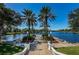 Stunning waterfront view with palm trees and landscaping at 1408 Riverside Dr, Tarpon Springs, FL 34689