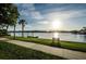 Scenic waterfront path with a bench at sunset at 1408 Riverside Dr, Tarpon Springs, FL 34689