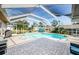 Sparkling pool enclosed in a screened lanai with paved patio, providing a relaxing outdoor space at 1575 Wicklow Dr, Palm Harbor, FL 34684