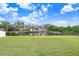 Spacious backyard with pond view and lush grass at 4214 Duck Creek Way, Ellenton, FL 34222