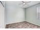 Empty bedroom with grey walls and wood-look floors at 4214 Duck Creek Way, Ellenton, FL 34222