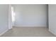 Grey bedroom with carpeted floors and a window at 4214 Duck Creek Way, Ellenton, FL 34222