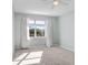 Bright bedroom with window, carpet, and neutral walls at 4214 Duck Creek Way, Ellenton, FL 34222