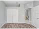 Bedroom with double doors leading to the bathroom and a large closet at 4214 Duck Creek Way, Ellenton, FL 34222