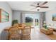 Bright dining area with patio access and wicker furniture at 4214 Duck Creek Way, Ellenton, FL 34222