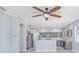 Modern kitchen with gray cabinets and breakfast bar at 4214 Duck Creek Way, Ellenton, FL 34222