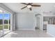 Living room with sliding glass doors leading to a patio and a view of the backyard at 4214 Duck Creek Way, Ellenton, FL 34222