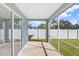 Bright screened porch with sliding glass doors at 4214 Duck Creek Way, Ellenton, FL 34222