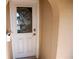 White front door with etched glass detail and silver door handle at 4368 Summersun Dr, New Port Richey, FL 34652