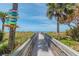 Wooden boardwalk leads to a sandy beach at 322 Windrush Blvd # 4, Indian Rocks Beach, FL 33785