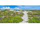 Sandy path through dunes to the beach at 322 Windrush Blvd # 4, Indian Rocks Beach, FL 33785