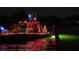 Decorated boat in nighttime Christmas parade at 322 Windrush Blvd # 4, Indian Rocks Beach, FL 33785