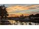 Scenic sunset over canal with boats at 322 Windrush Blvd # 4, Indian Rocks Beach, FL 33785