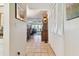 Bright and airy entryway leading into the living area at 322 Windrush Blvd # 4, Indian Rocks Beach, FL 33785