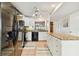 Bright kitchen with granite countertops and stainless steel appliances at 322 Windrush Blvd # 4, Indian Rocks Beach, FL 33785