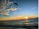Sunset over ocean with paraglider at 322 Windrush Blvd # 4, Indian Rocks Beach, FL 33785
