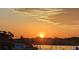 Sunrise over calm canal with homes at 322 Windrush Blvd # 4, Indian Rocks Beach, FL 33785