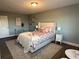 Spacious bedroom with plush bed, nightstand and decor at 3315 58Th S Ave # 421, St Petersburg, FL 33712