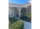 Front entryway with arched windows and landscaping at 3606 Belle Vista E Dr, St Pete Beach, FL 33706