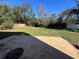 Large backyard with patio and mature trees at 3619 Springville Dr, Valrico, FL 33596