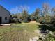 Large grassy backyard with wooden fence at 3619 Springville Dr, Valrico, FL 33596