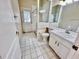 Bathroom with white vanity, toilet and shower at 3619 Springville Dr, Valrico, FL 33596