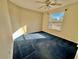 Bright bedroom with ceiling fan and blue carpet at 3619 Springville Dr, Valrico, FL 33596