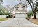 Two-story house with attached garage and landscaped yard at 3619 Springville Dr, Valrico, FL 33596