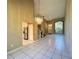 Open living and dining area with tile floors and a chandelier at 3619 Springville Dr, Valrico, FL 33596