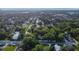 Aerial view showing home's location in a lush, residential neighborhood at 37439 Meridian Ave, Dade City, FL 33525