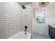 Updated bathroom with subway tile shower and modern fixtures at 37439 Meridian Ave, Dade City, FL 33525