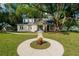 Charming brick home with a spacious lawn and mature trees at 37439 Meridian Ave, Dade City, FL 33525