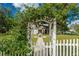 Charming house with a vine-covered arbor and walkway at 37439 Meridian Ave, Dade City, FL 33525